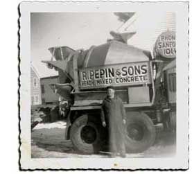 Man Standing Next To A Concrete Mixer — Sanford, ME — R. Pepin and Sons Inc.