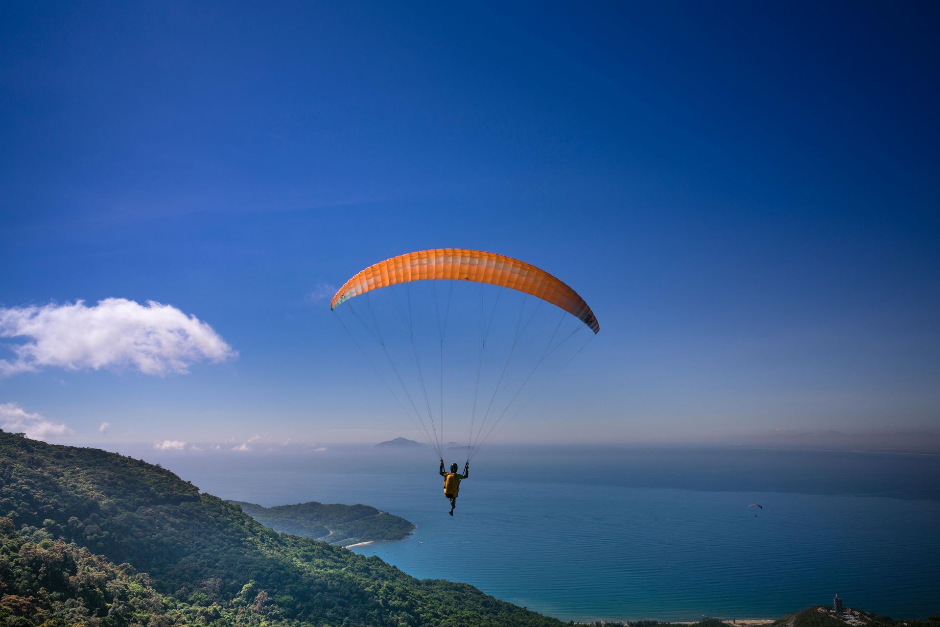 A person doing parachuting above the seat