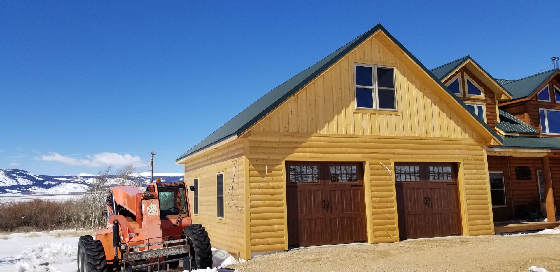 House with Two Garage Door — Laramie, WY — Southeastern Wyoming Garage Doors