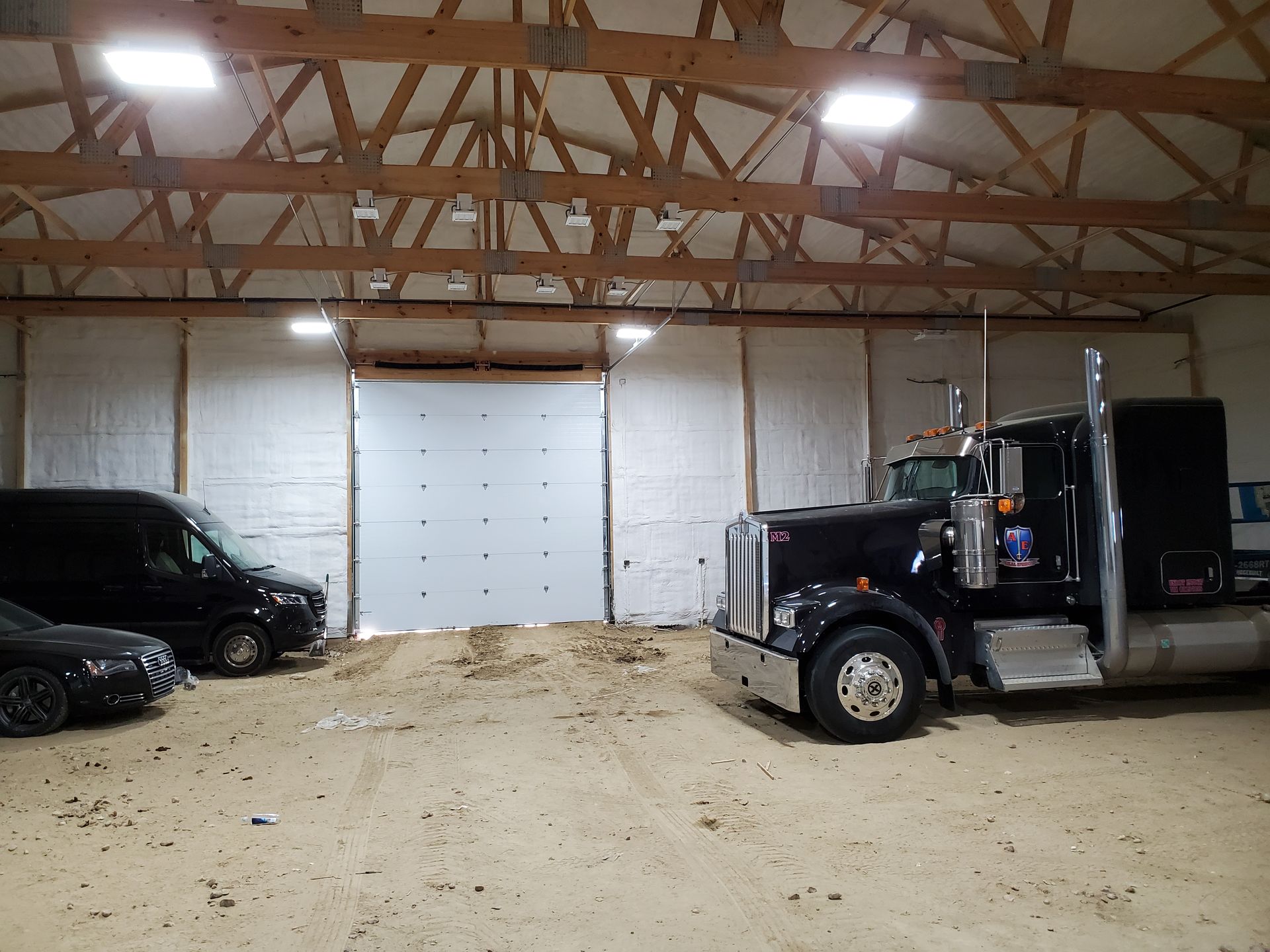 Vehicles Inside Garage — Laramie, WY — Southeastern Wyoming Garage Doors