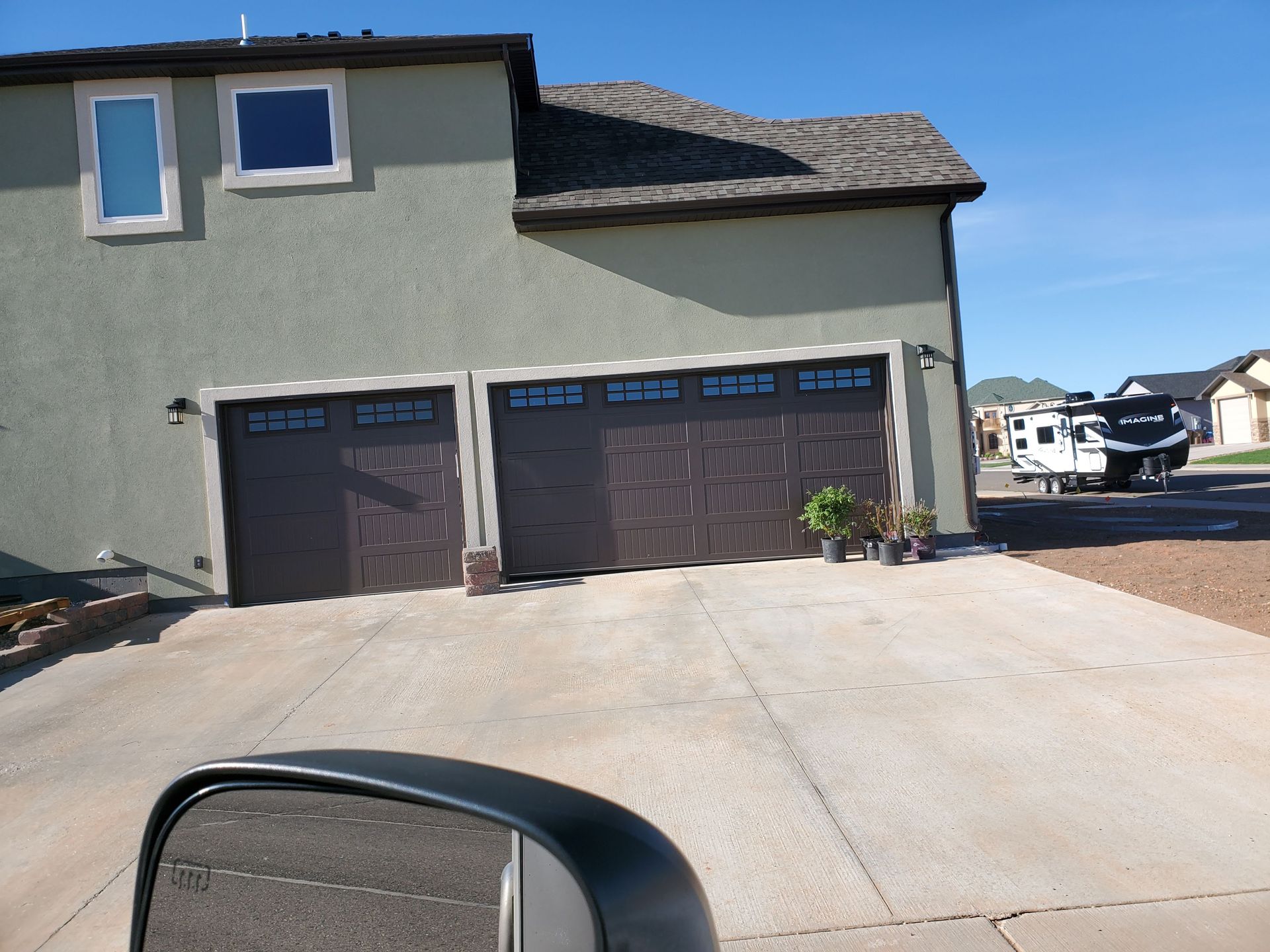 House with Garage Door — Laramie, WY — Southeastern Wyoming Garage Doors