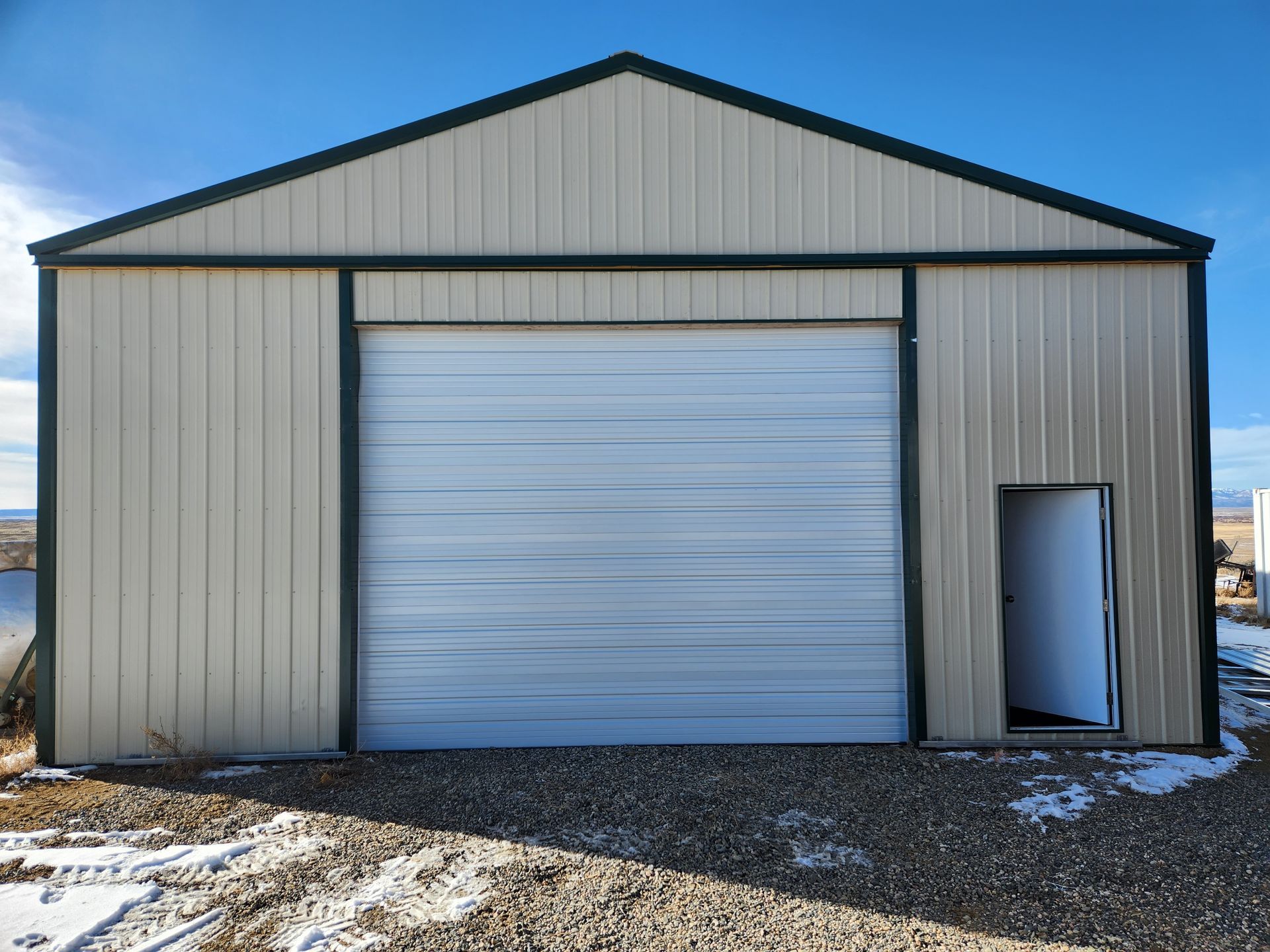 Warehouse with White Garage Door — Laramie, WY — Southeastern Wyoming Garage Doors