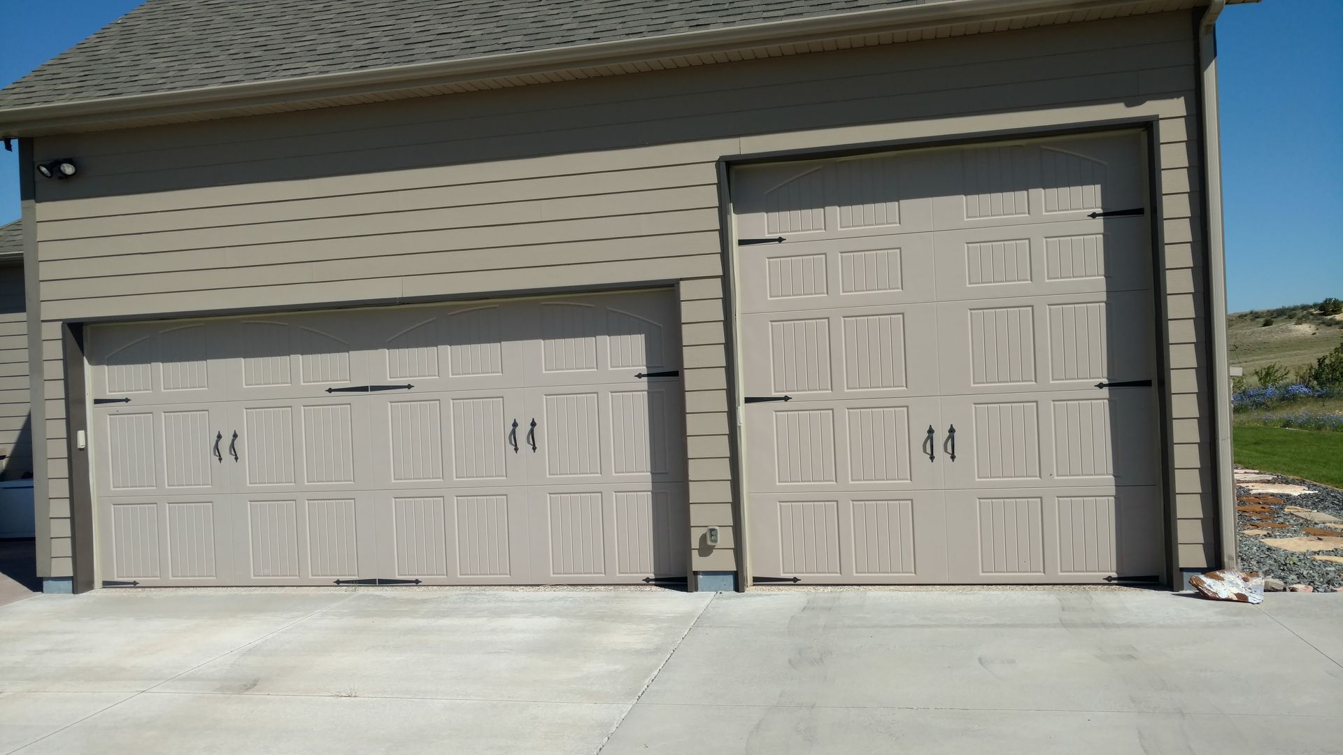 Residential House with Two Garage Doors — Laramie, WY — Southeastern Wyoming Garage Doors