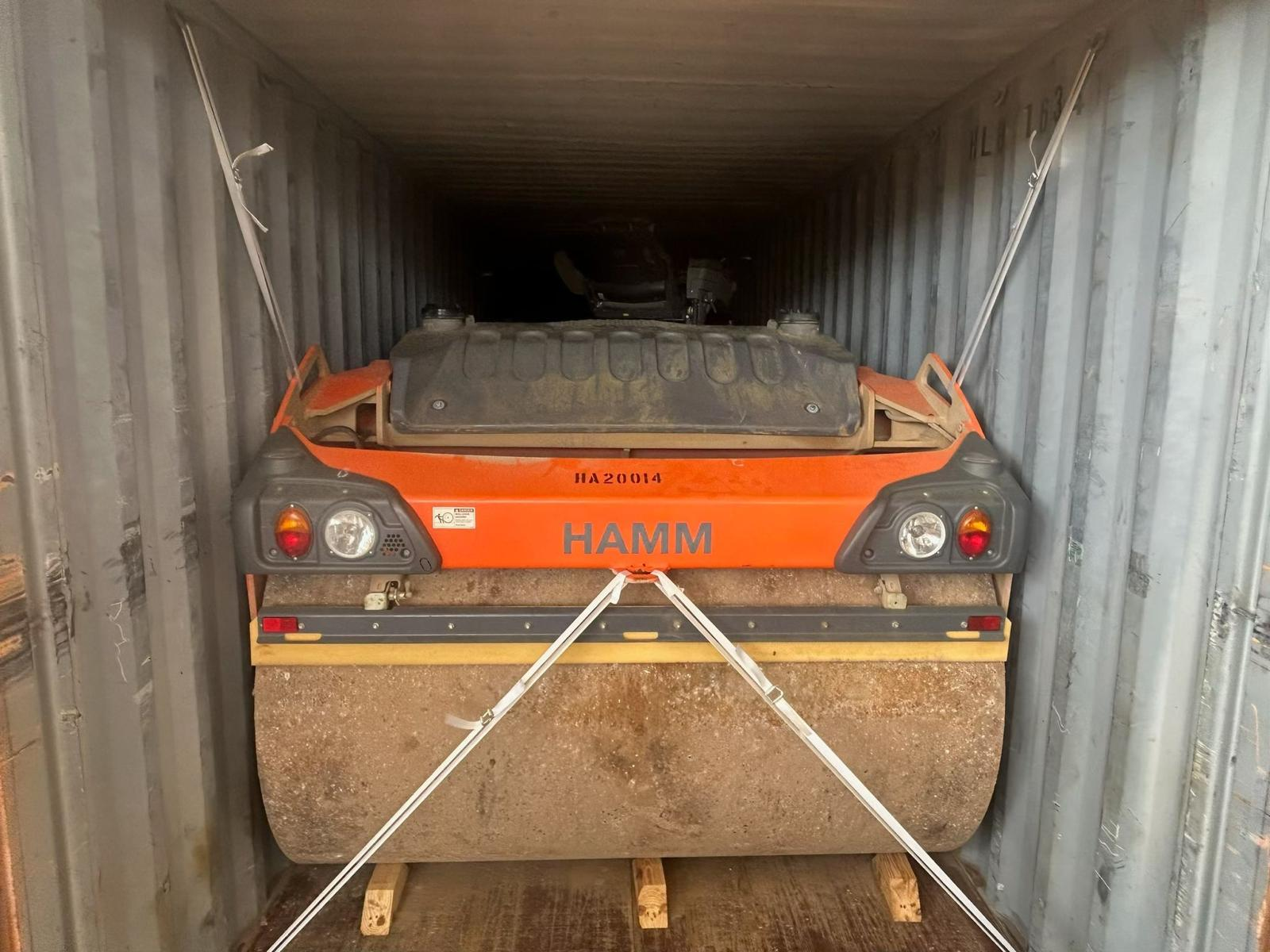 scissor lift loading into shipping containter