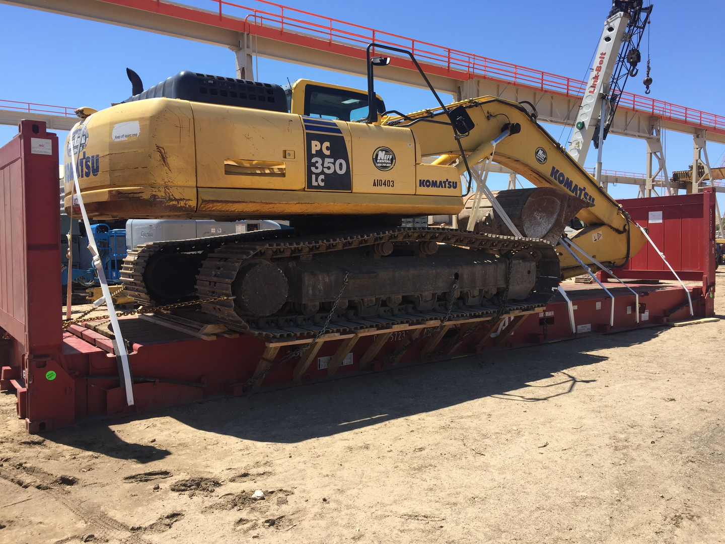 Construction Equipment loaded onto flatrack