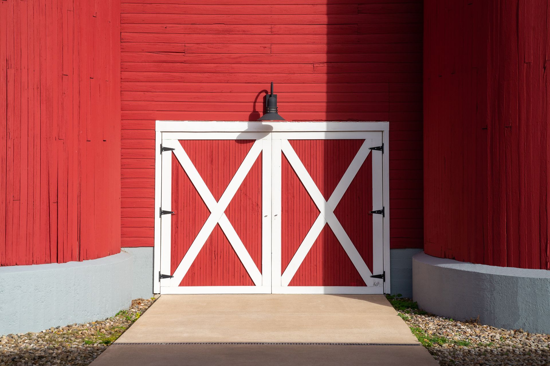 Barn door painting project in Western Massachusetts, applying durable coatings to large sliding doors and entryways.