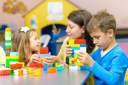 Children playing with teacher — Daycare Services in Hermantown, MN