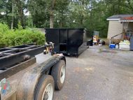 Dumpster Rental delivery in driveway