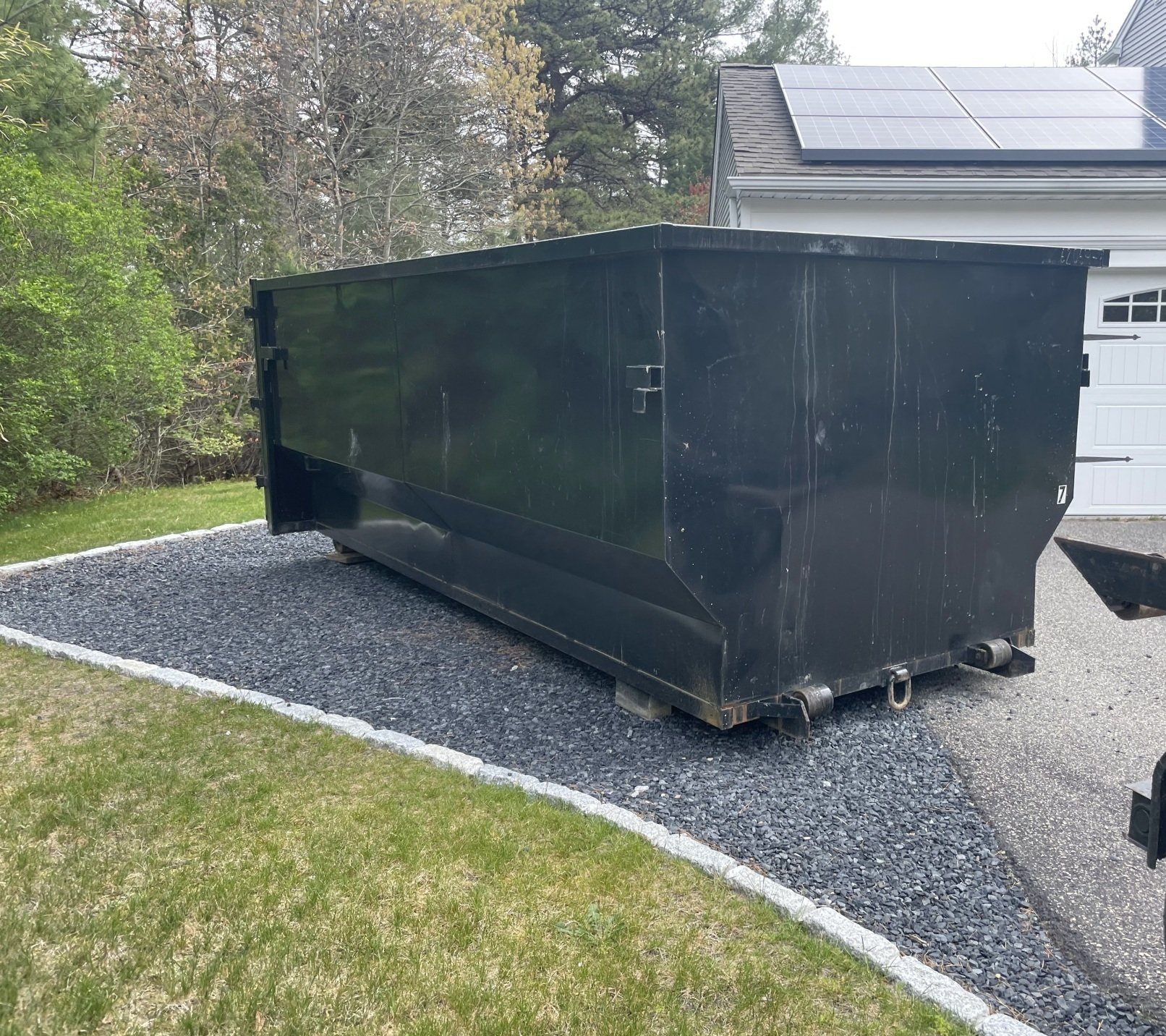 dumpster on driveway