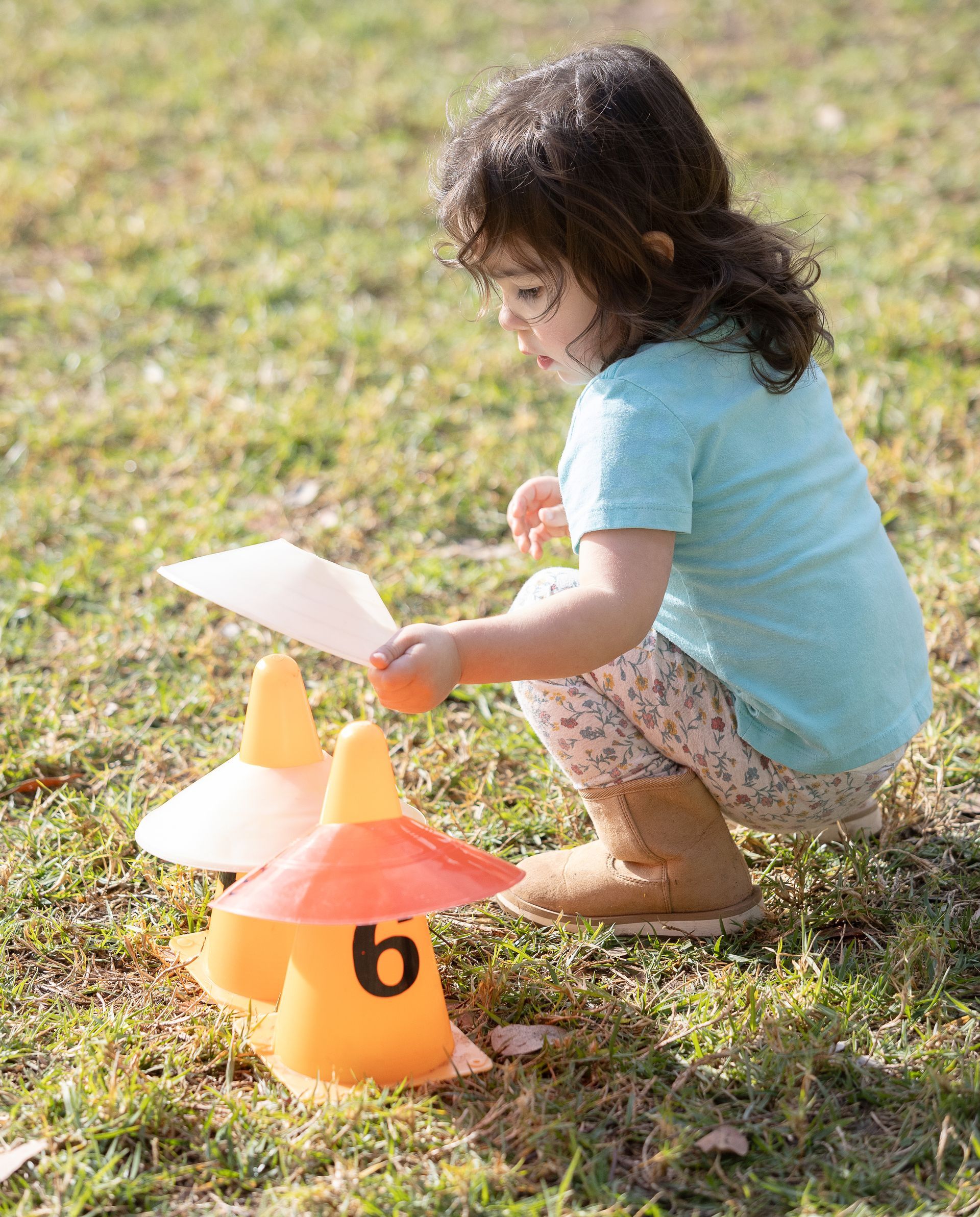 Montessori child participating in an outdoor activity.