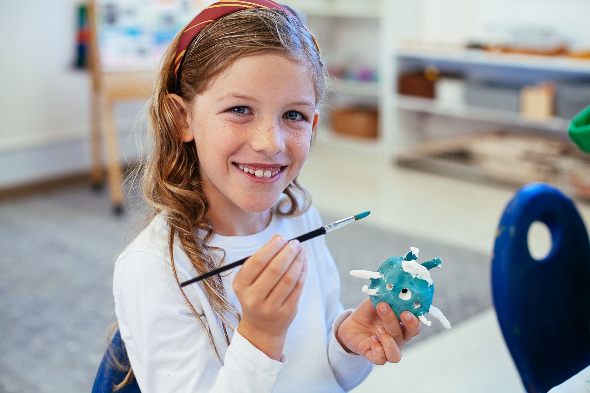 Montessori child working on an art project.
