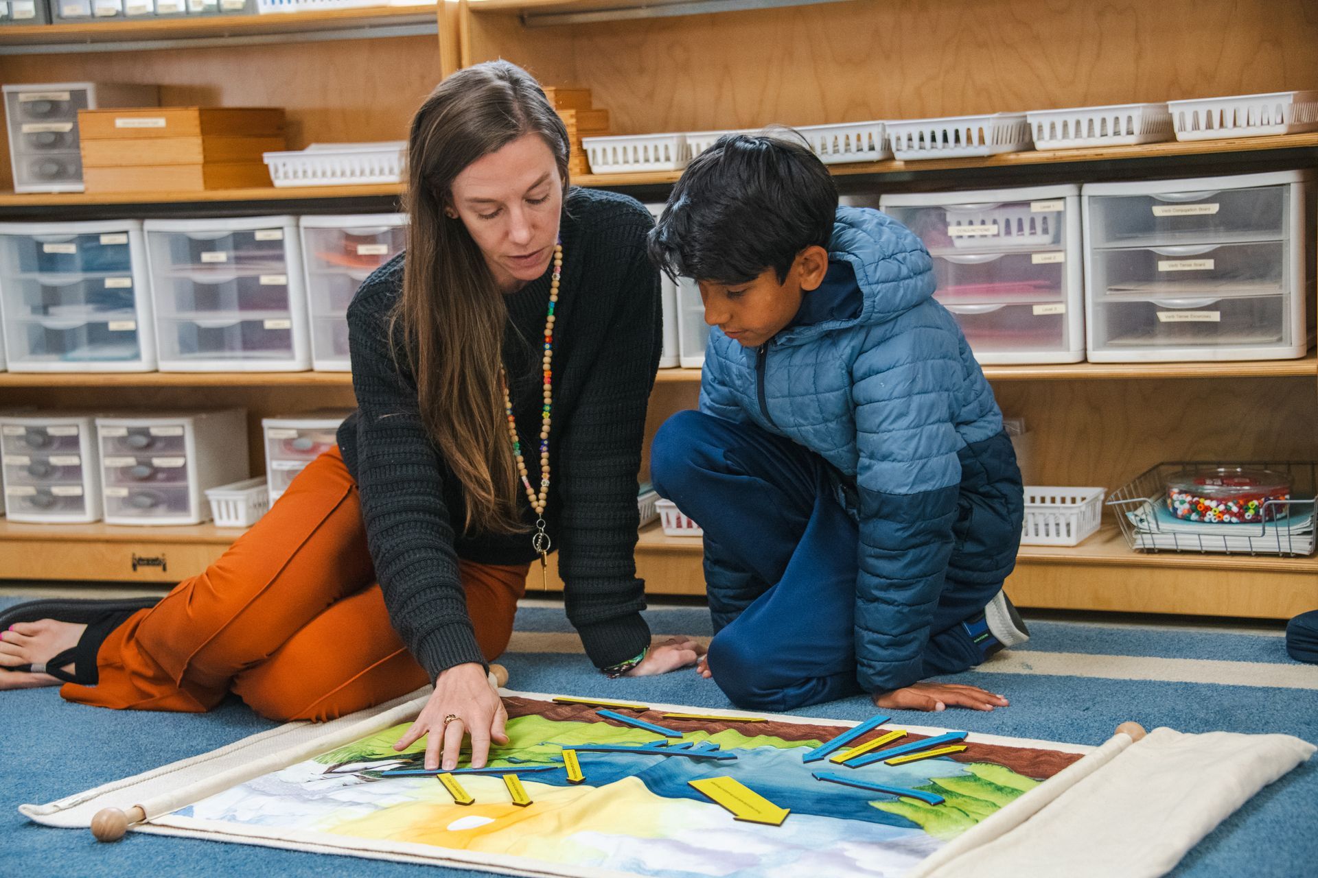 Montessori guide and child during a lesson.