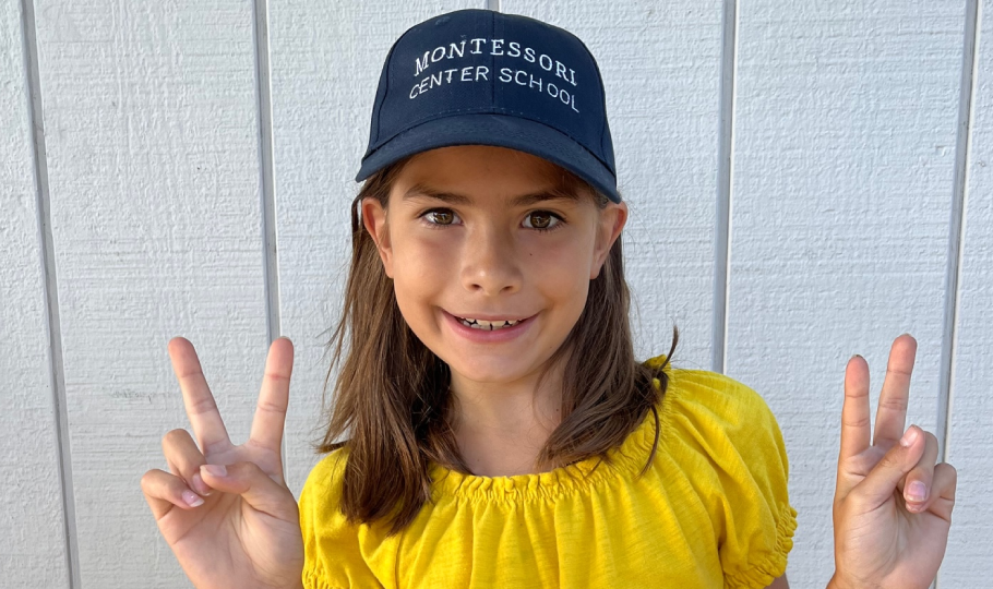 Montessori child wearing MCS cap