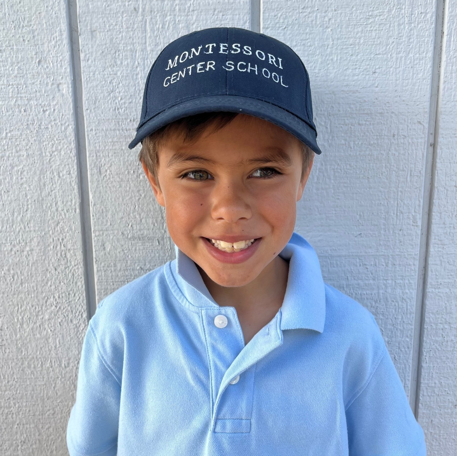 Montessori child wearing MCS cap