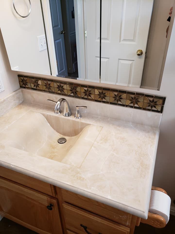 A bathroom vanity with a sink and a mirror.