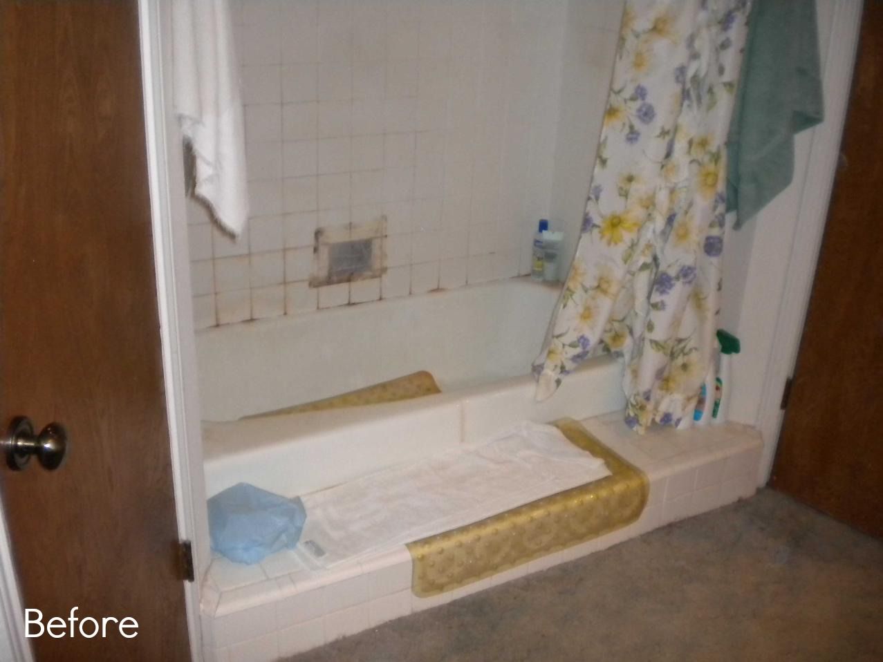 A before picture of a bathroom with a bathtub and shower curtain