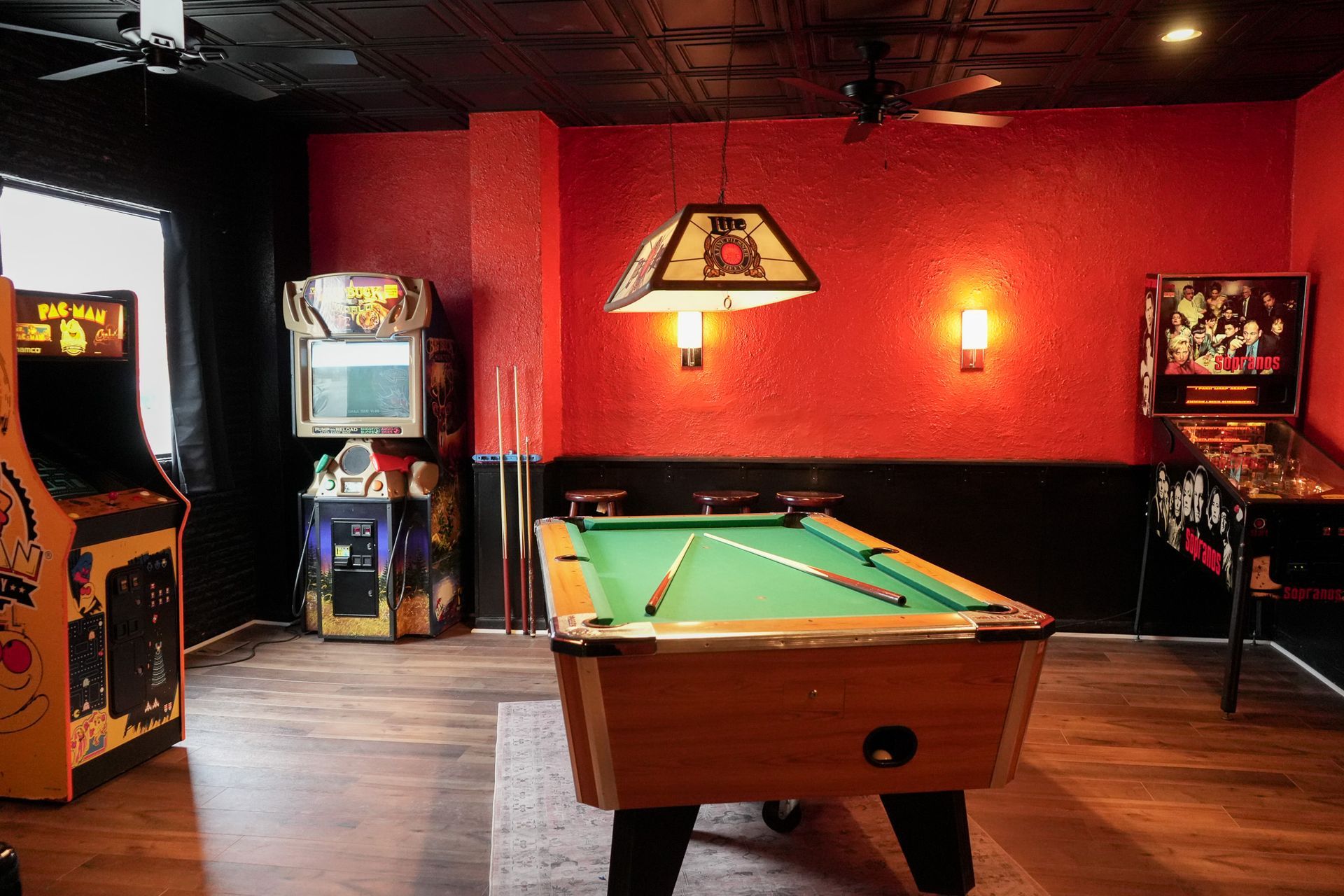 A retro game room featuring pool, pinball and Mrs. Pac man at Bad Ending