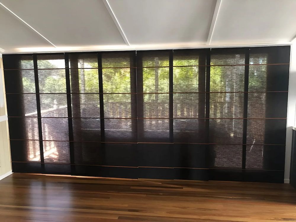 A Room With A Lot Of Windows And A Wooden Floor — Advantage Screens and Blinds Hervey Bay In Pialba, QLD