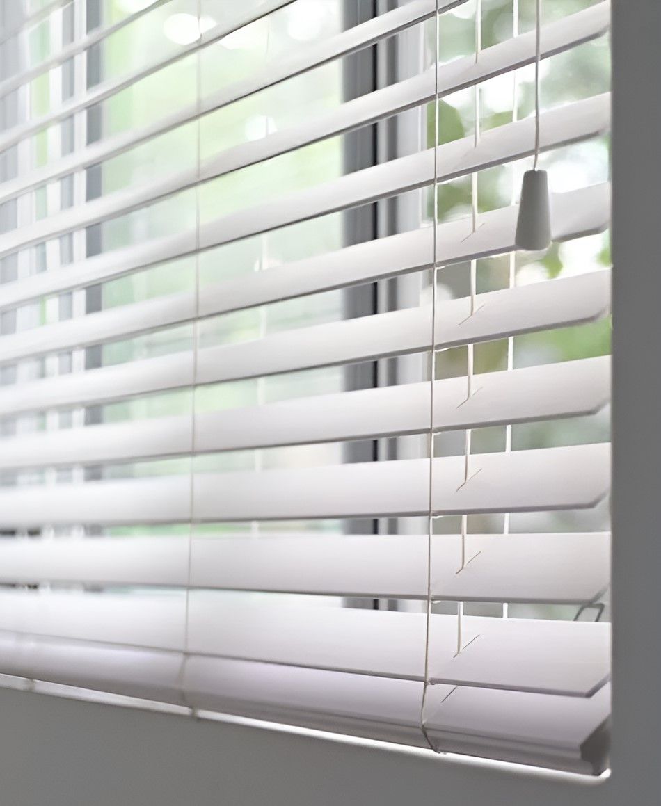A Close Up Of A Window With White Blinds On It — Advantage Screens and Blinds Hervey Bay In Pialba, QLD