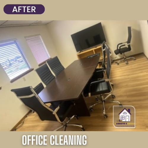 Clean office conference room with table, chairs, TV, and window.
