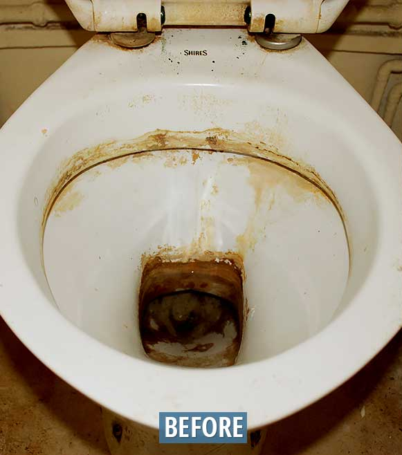 Dirty toilet bowl, stained with brown deposits, inside view, 