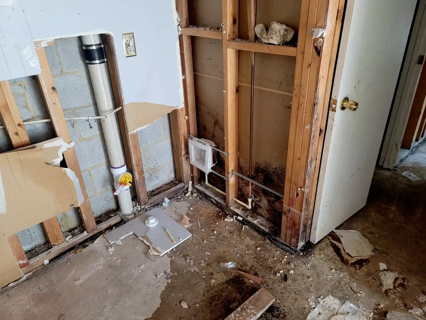 A bathroom is being remodeled and has a hole in the floor.