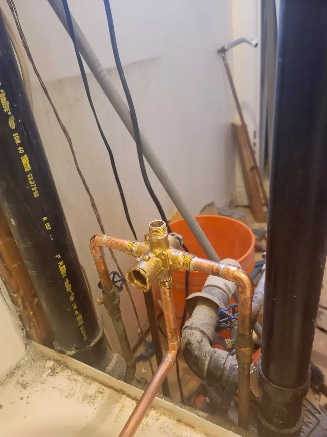 A bunch of pipes are connected to each other in a room