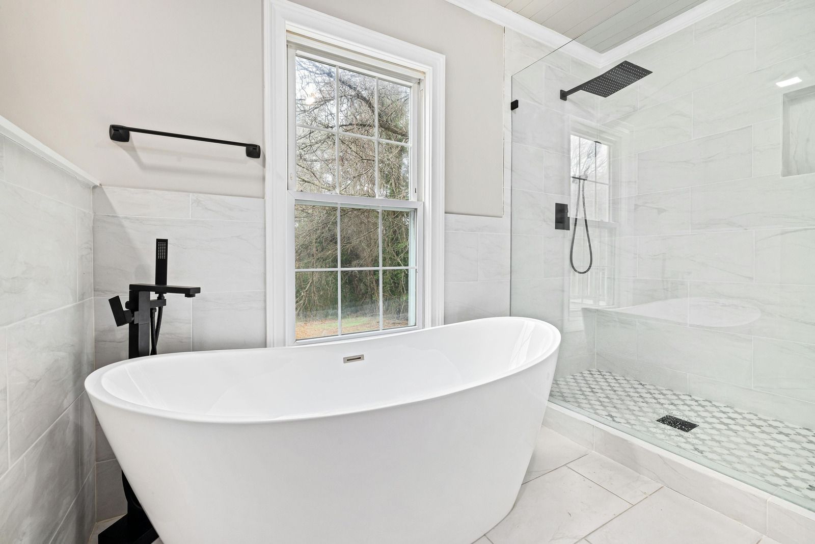 A laundry room with a washer and dryer and a sink