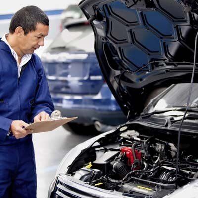 Man inspecting car - Walt's Auto Service Center, Taunton, MA