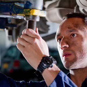 Man inspecting car - Walt's Auto Service Center, Taunton, MA