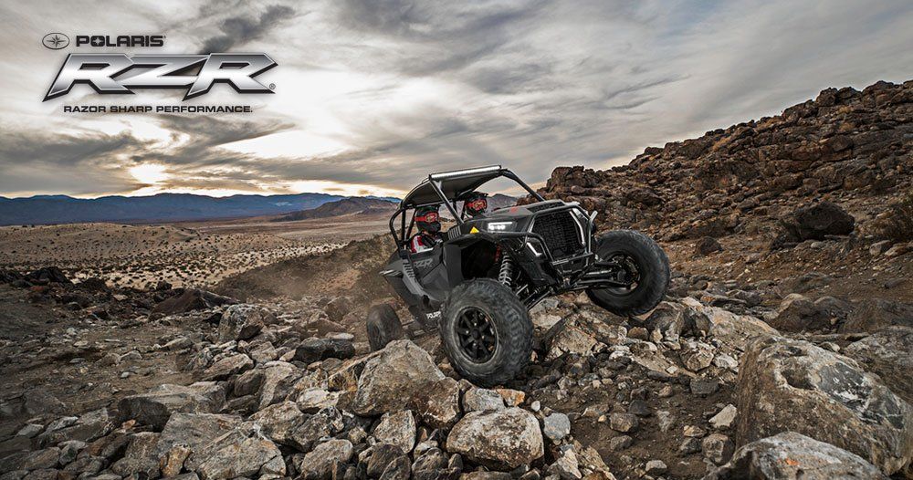 Couple driving Polaris RZR rental from Tucson Adventure Rentals