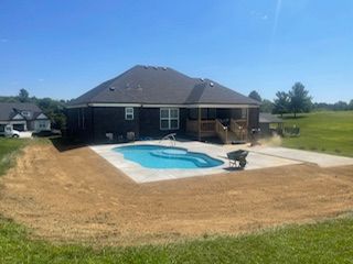 A large house with a swimming pool in the backyard.