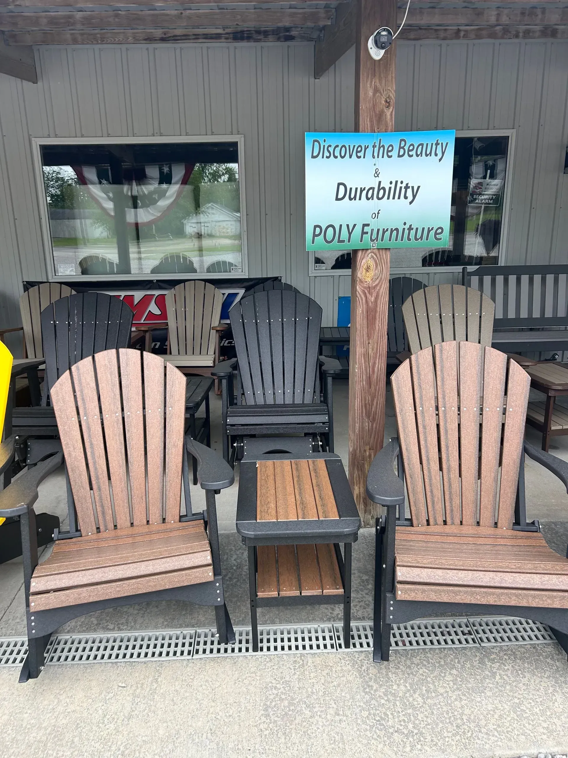 Outdoor poly furniture display with chairs and side tables.