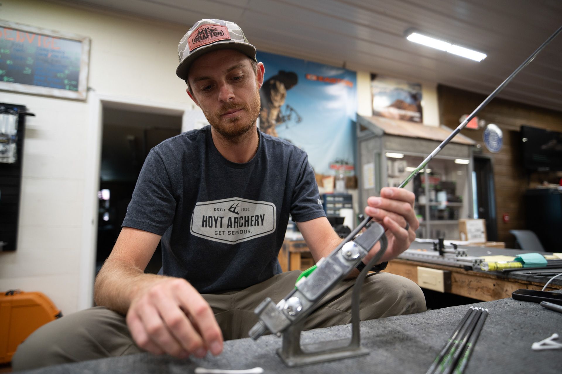 man disassembling bow