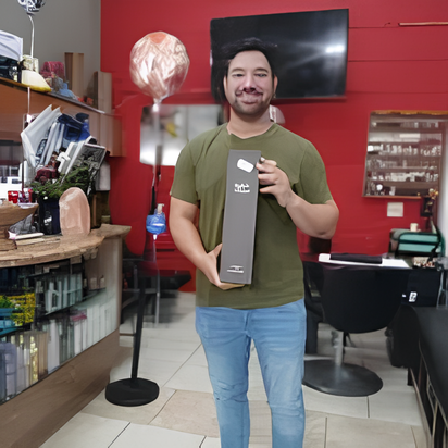 Two technicians repairing water damage: One kneels with a tool, the other adjusts a blower.