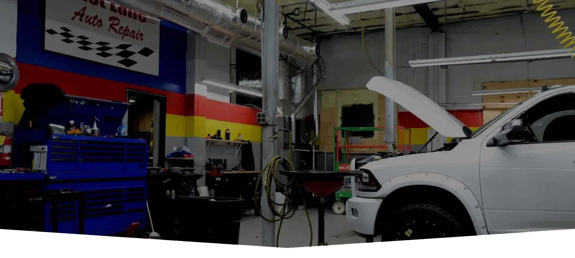 White truck inside of our garage in Owensboro, KY | Fast Lane Auto Repair
