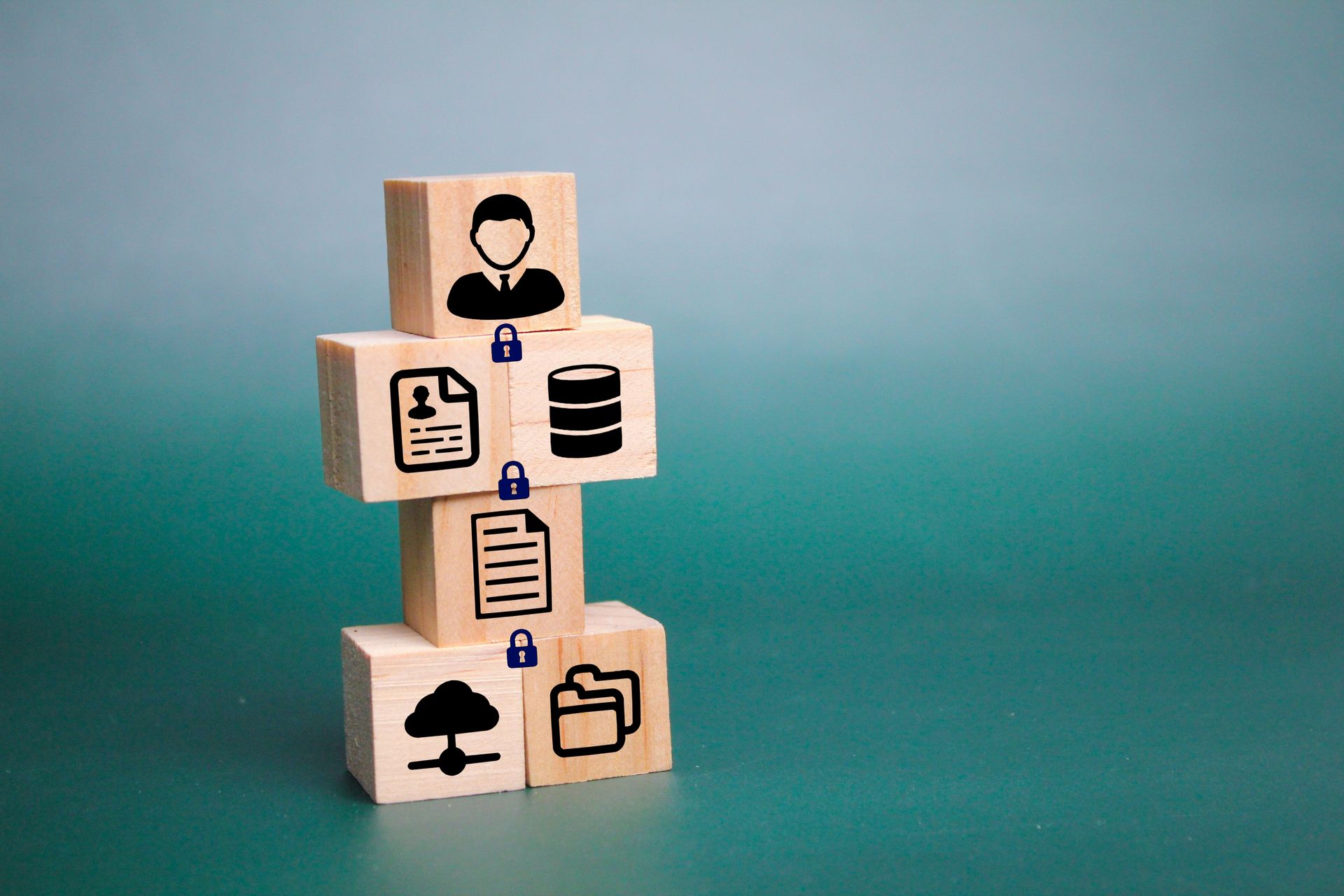 A stack of wooden blocks with icons on them.