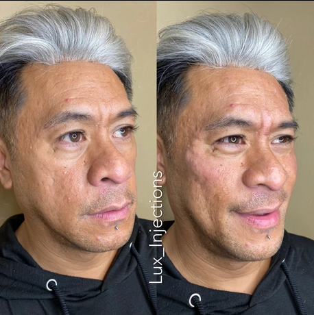 A man with gray hair is wearing a black hoodie