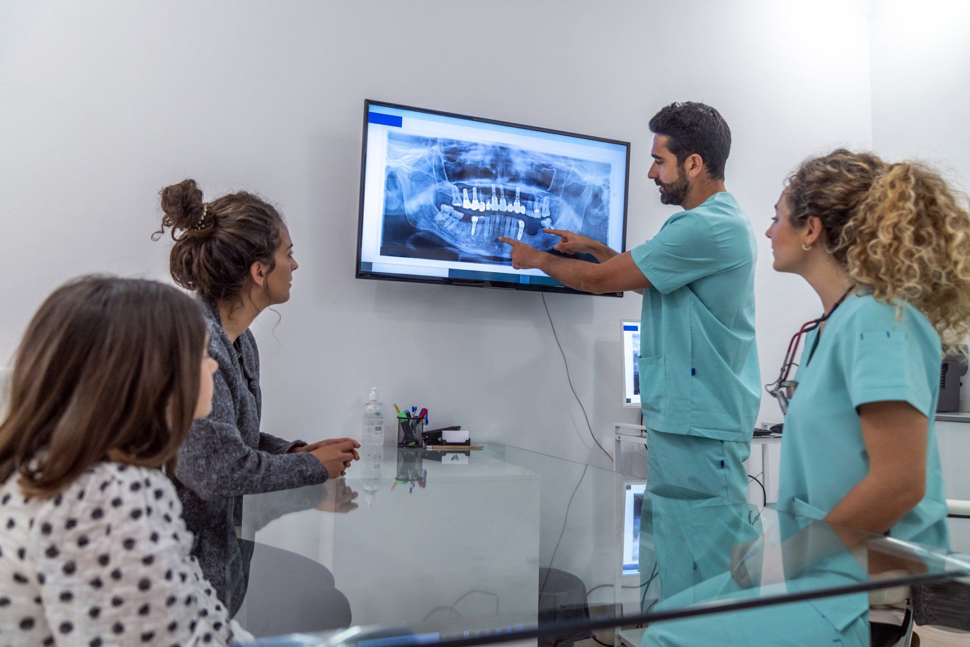 Two Dentists Explaining To The Patient - Huntington, WV - Dr. Ben Brown The Denture Store