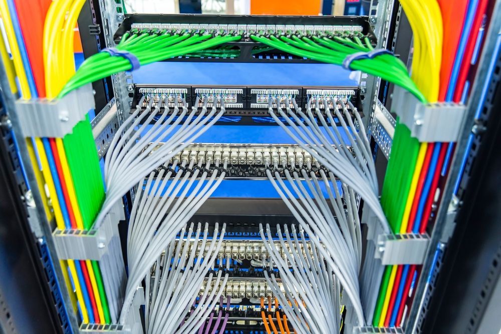 A Server Rack Filled With Lots Of Colourful Wires And Cables — Country to Coast Cabling in Rockhampton, QLD