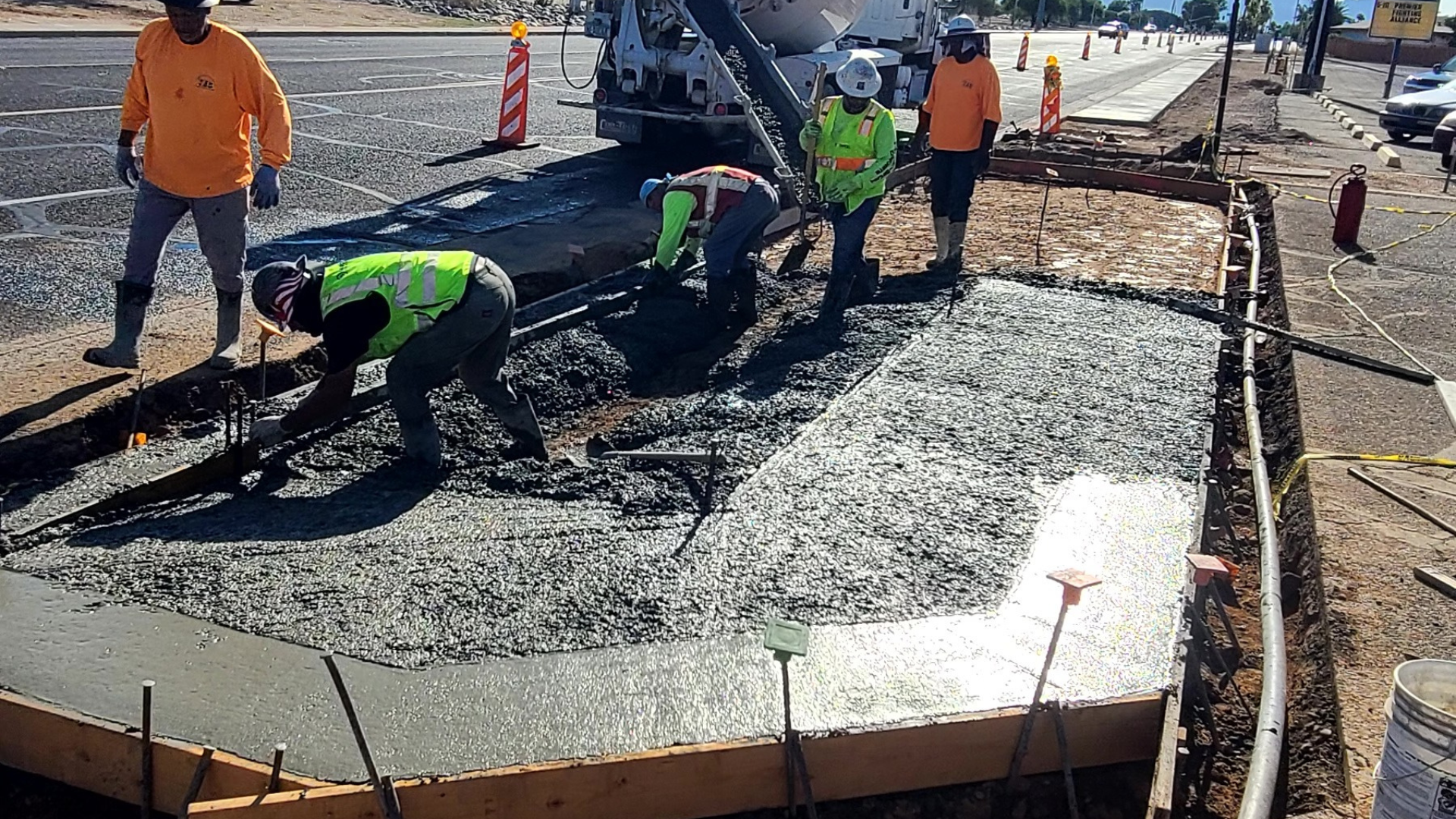 A concrete curb is sitting on the side of a road.