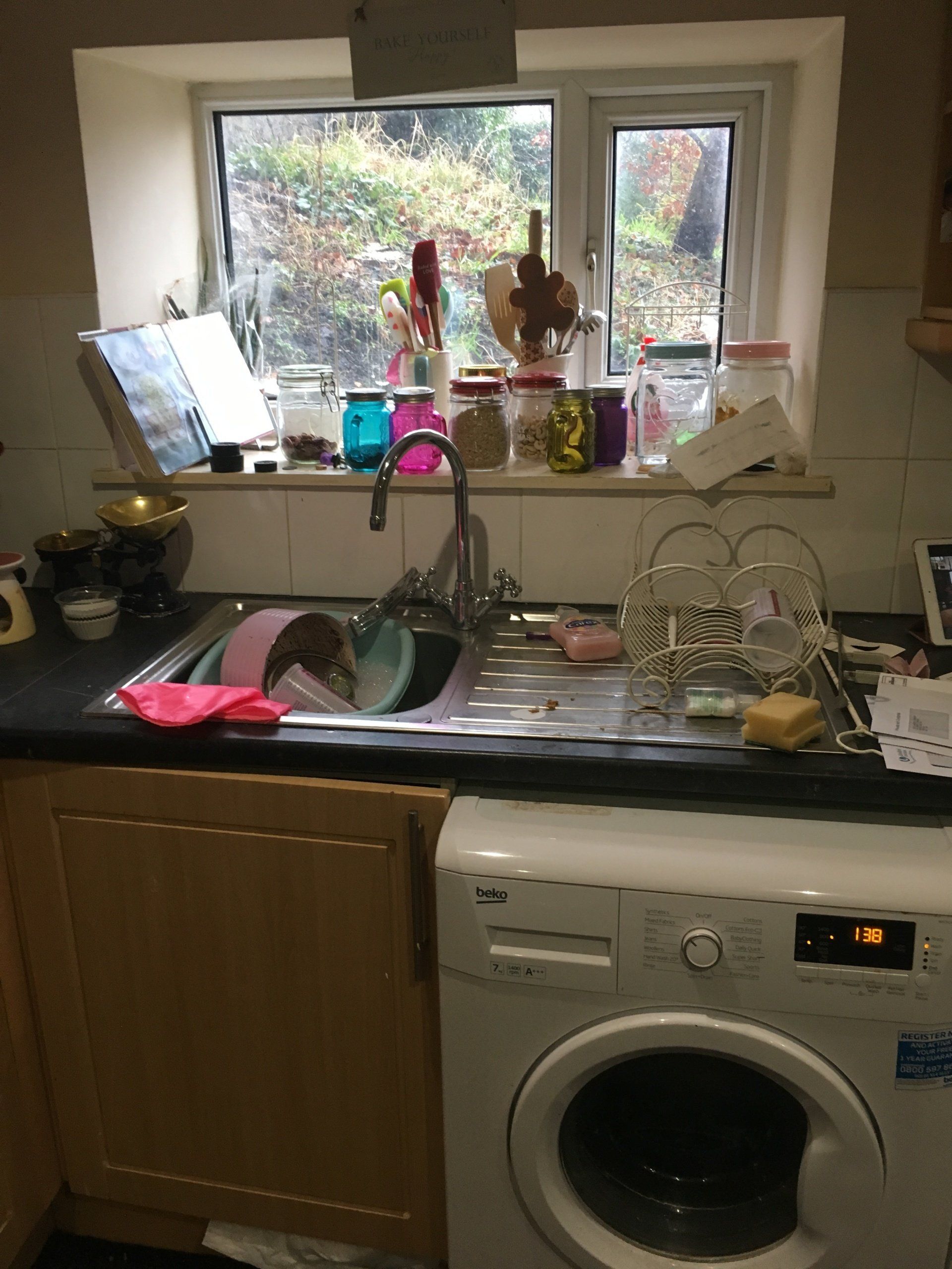 Kitchen with cluttered sink area