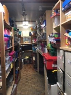 View of After School Club storage cupboard after decluttering and organising