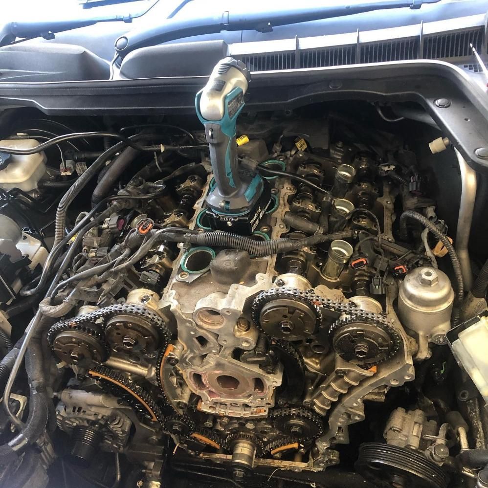 A Car Engine With A Drill Sitting On Top Of It — SG Mobile Mechanic In Lake Macquarie, NSW