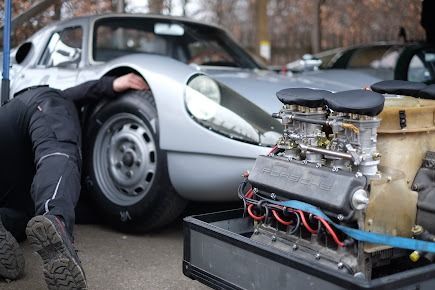 A Man Is Working On The Engine Of A Car — SG Mobile Mechanic In Lake Macquarie, NSW