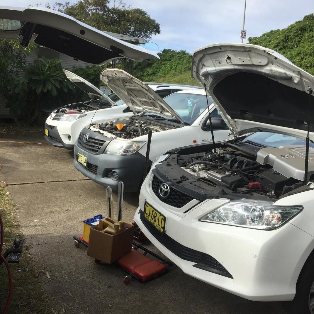 A Row Of White Cars With Their Hoods Open — SG Mobile Mechanic In Newcastle, NSW