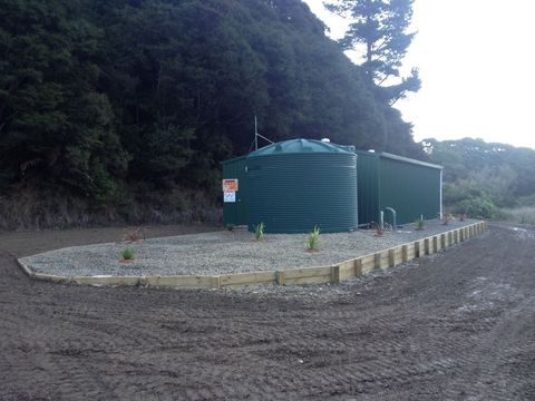 drainlaying experts working on a tank in Opotiki