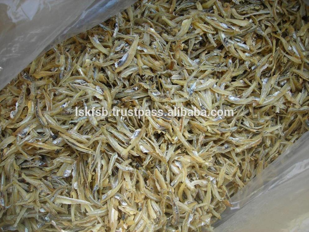 Dried anchovies in a clear plastic bag, appearing beige and tan.