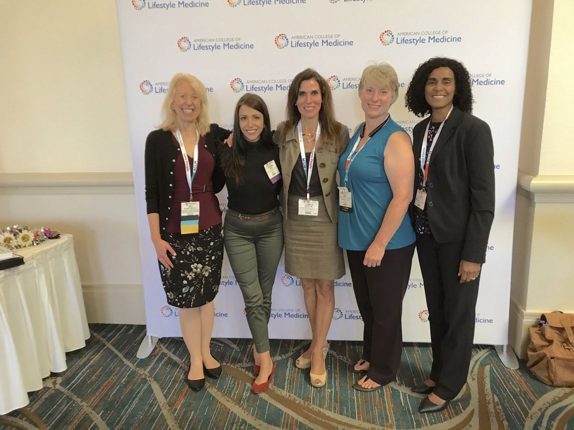 Dr. Beth Frates at the 2019 ACLM conference signing copies of her book The Lifestyle Medicine Handbook: An Introduction to the Power of Healthy Habits.