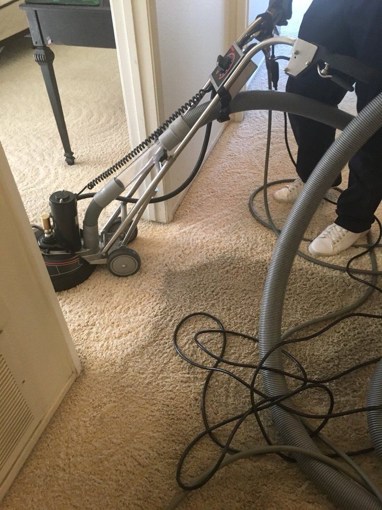 Carpet Stain Removal — Man Using Carpet Cleaner Machine in Santa Clarita, CA